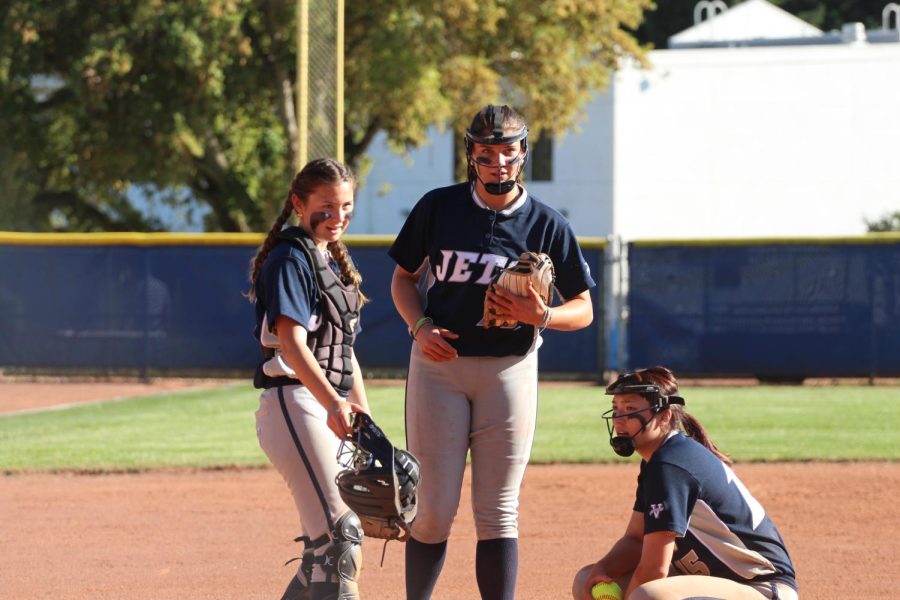 Amy Screechfield (11), Lola Whalen (11) and Celeste Hurtubise (11) rest during a mound visit on May 16. The temperature reached over 85°F in Walnut Creek, CA.