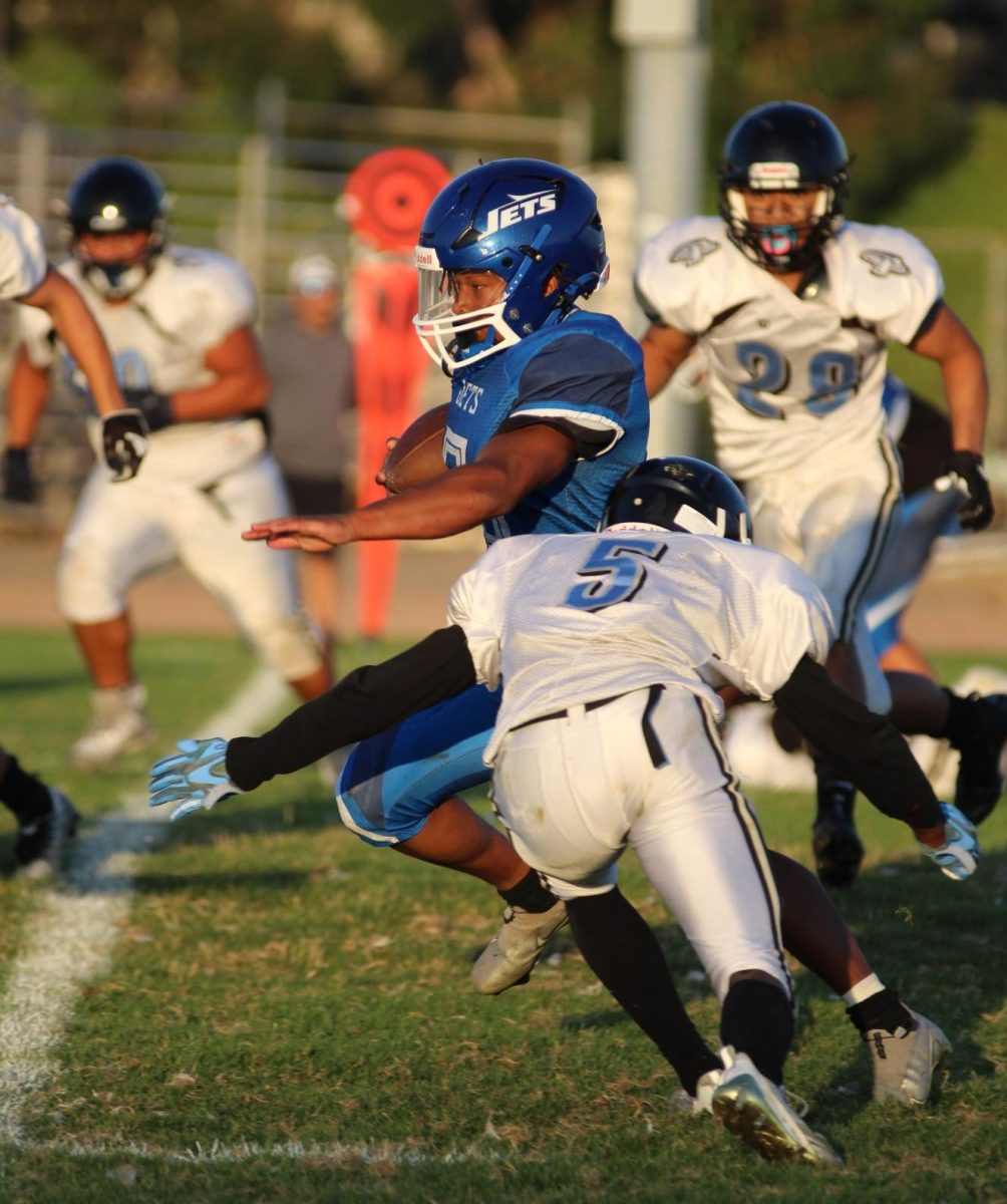 Junior Alex Marston runs for a short gain against Herculus. Marston had 194 yards and 3 TDs in the game.