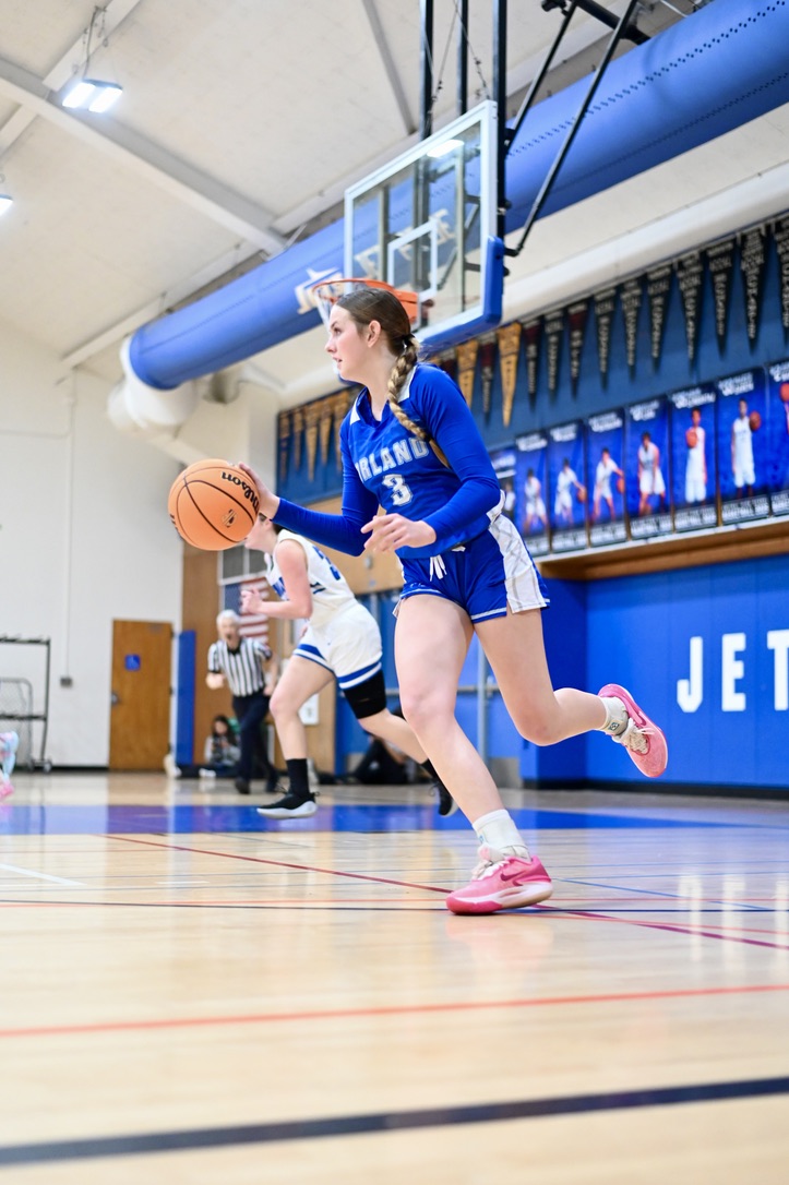 Orland High junior Dottie Davis dribbles the ball down the court in game against Encinal High on 3/6/25.