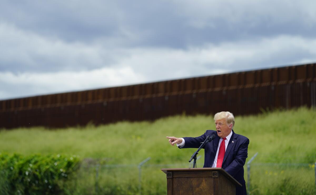 Trump, in 2021, delivering speech about immigration law at the unfinished border wall in Texas. Photo Courtesy of  
Eric Gay, Associated Press