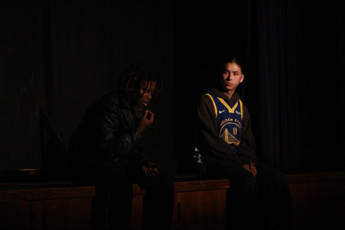 Satchel Mercer as Pascal and Colby Tong as Anon engage in a dialogue in the fall production of Anon(ymous) on Nov. 21, 2025.