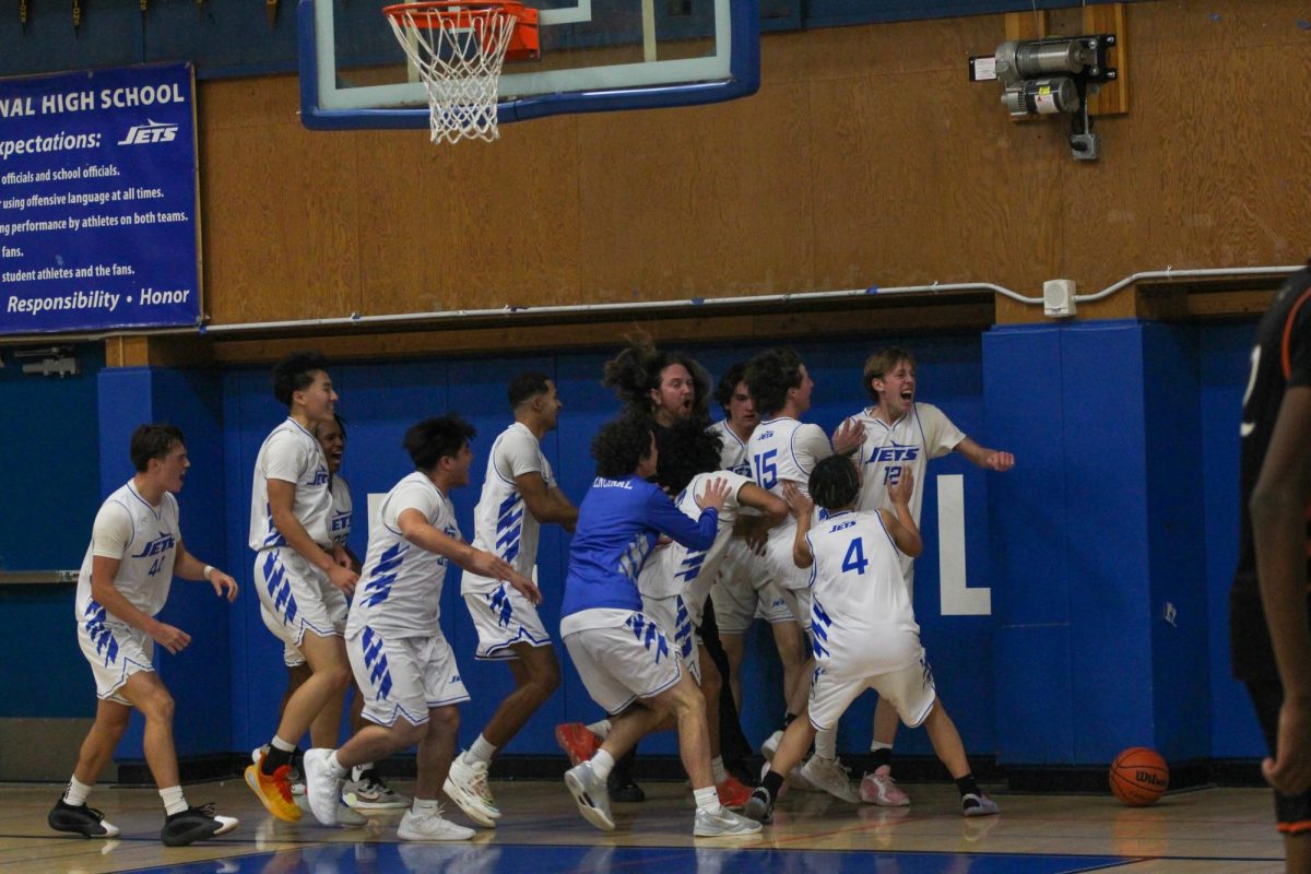 The Jets mob sophomore Max Busch after his game-winning shot.