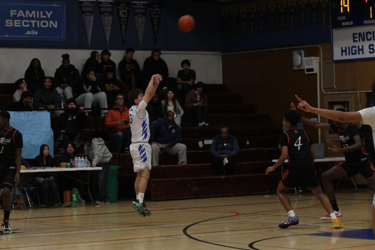 Senior Amaru Guerra makes a three-point shot against McClymonds.