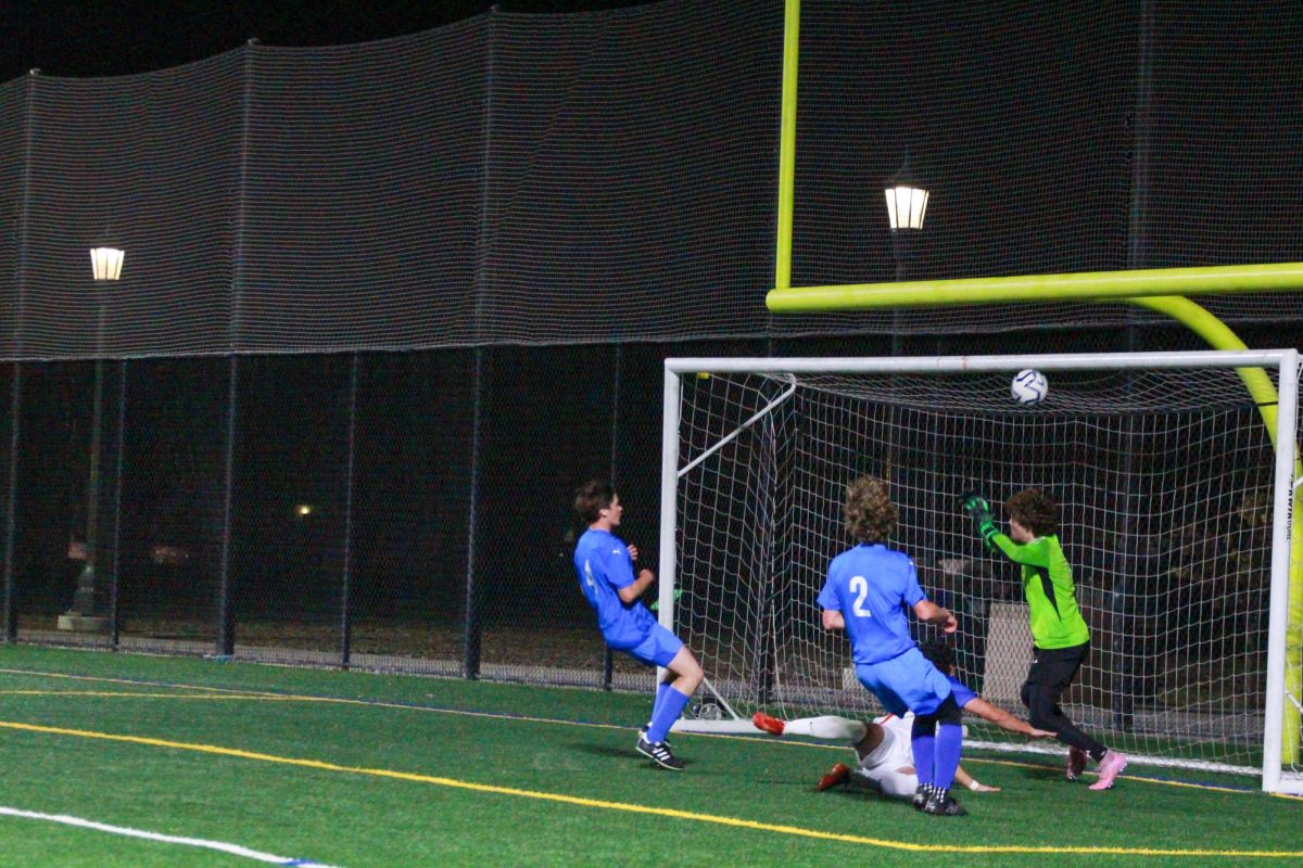 Goalie Finley Collins makes a save to keep the score deadlocked at 0-0.