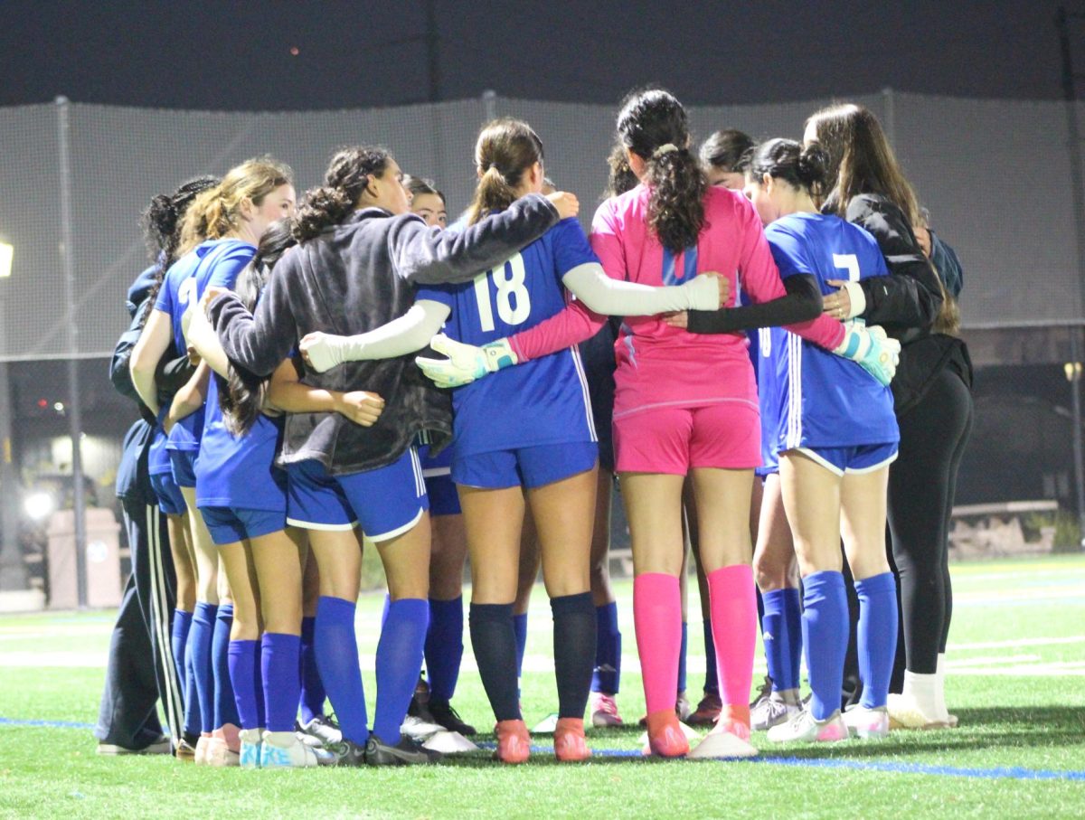 The Jets huddle together after a game against Oakland Tech on Dec. 5
