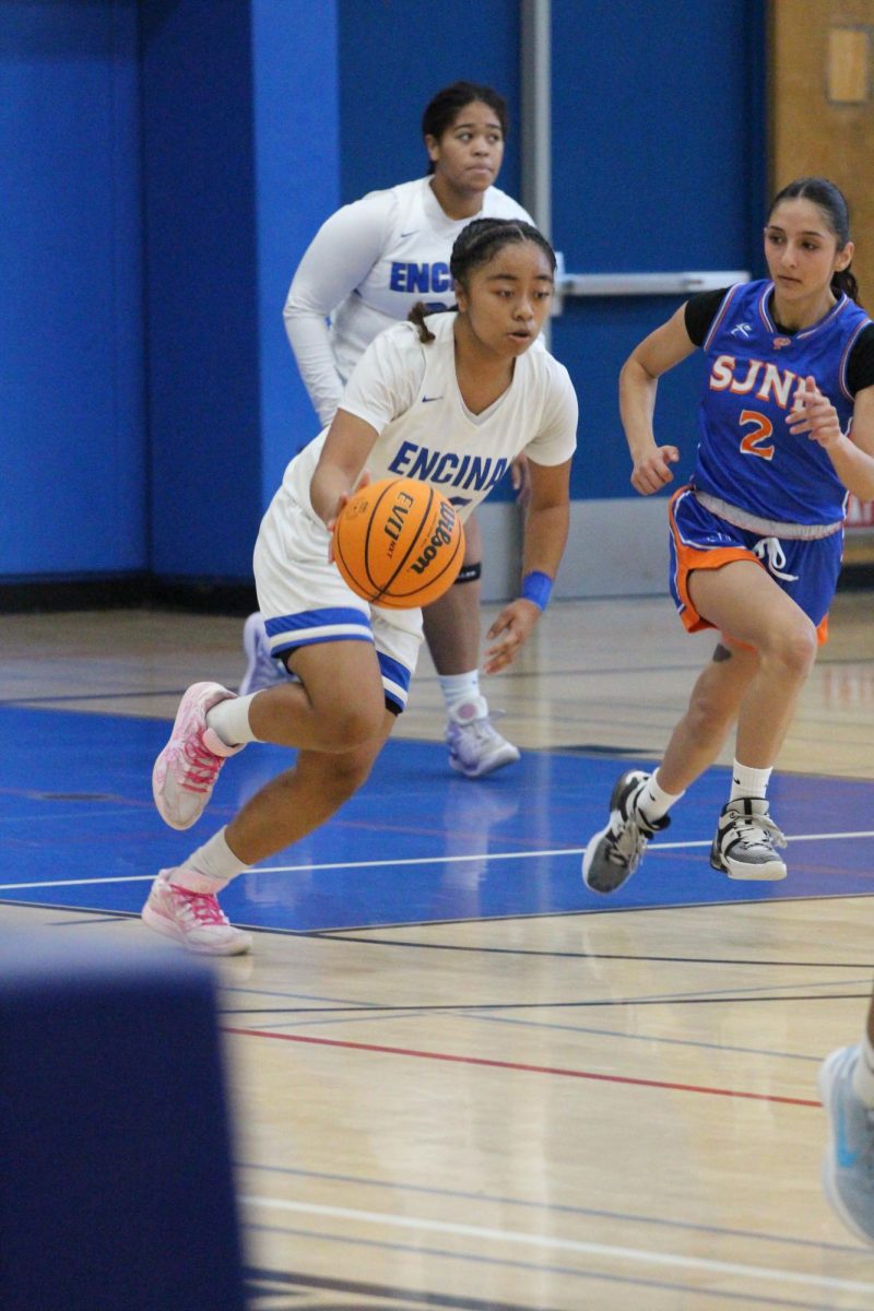 Keianna Rayndles (12) dribbles down the court against Saint Joseph's on Dec. 20