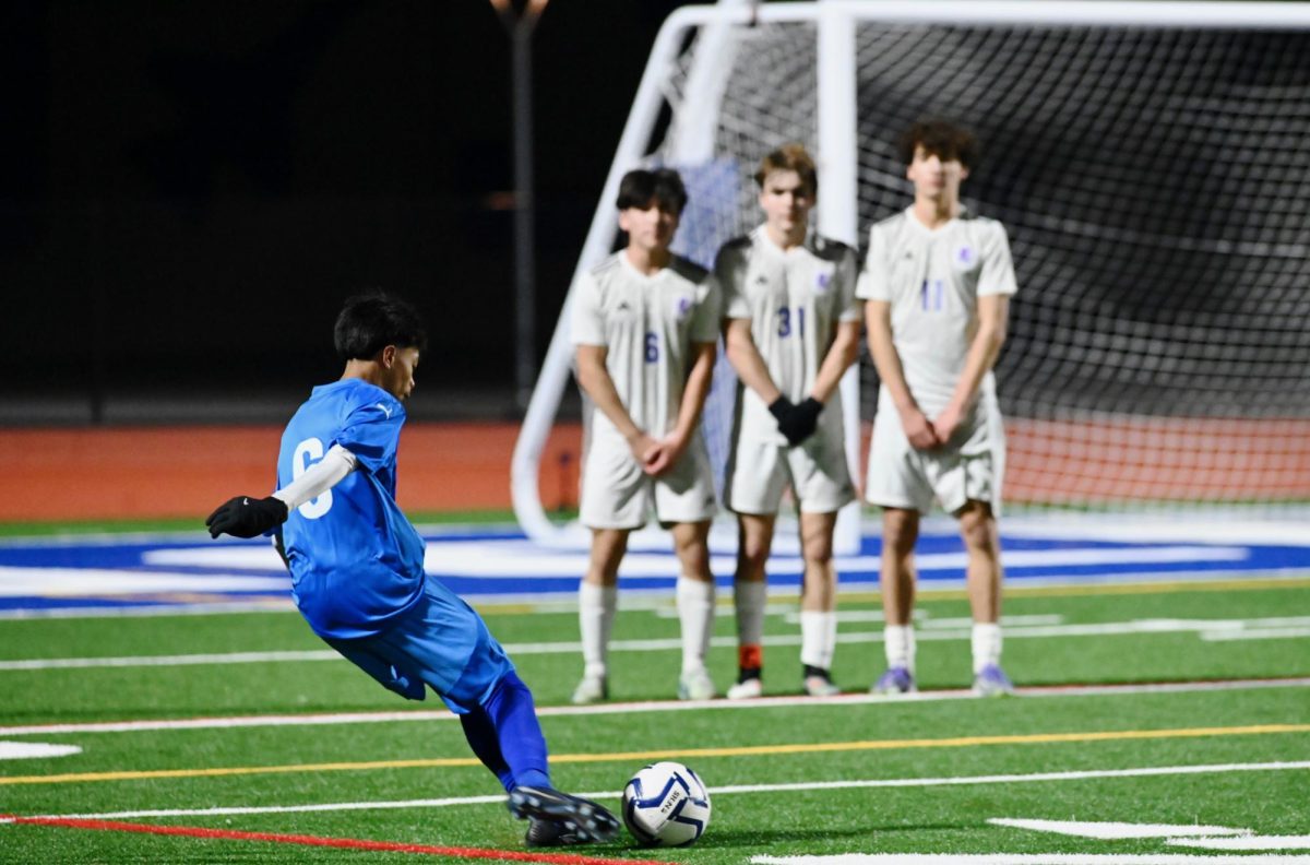 Jairo Fernandez (9) takes a penalty kick against Piedmont on Jan. 9