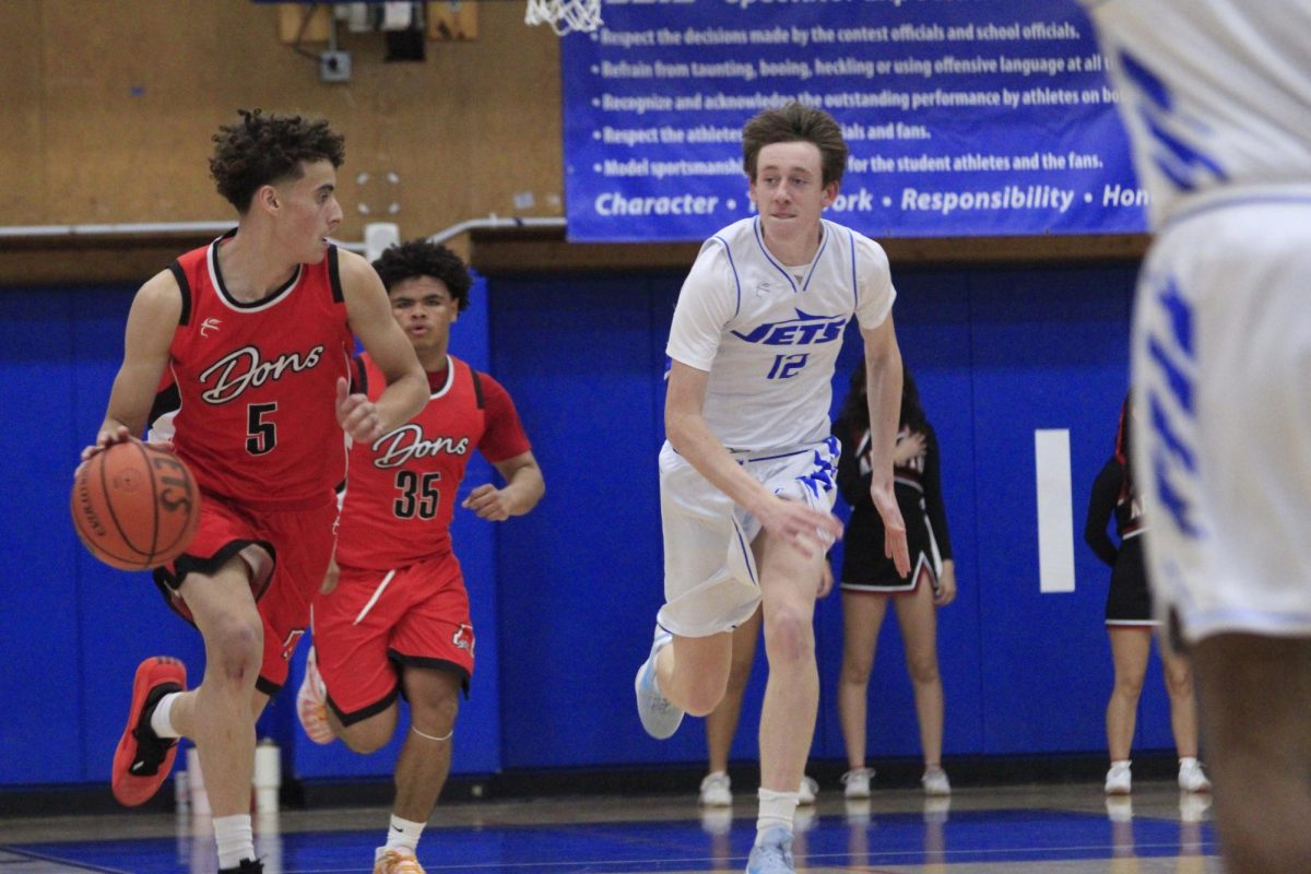 Sophomore Max Busch chases down an Arroyo guard on Jan. 16.
