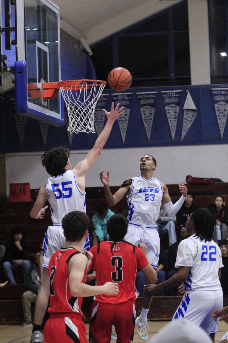 Junior Orion Juhas goes up for a rebound against Arroyo on Jan. 16. Encinal fell 58-51.