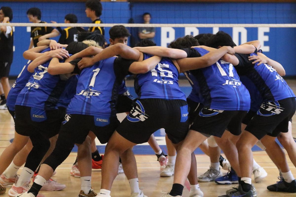 Encinal men's volleyball team huddles in preparation for Island Spike on March 25, 2026.