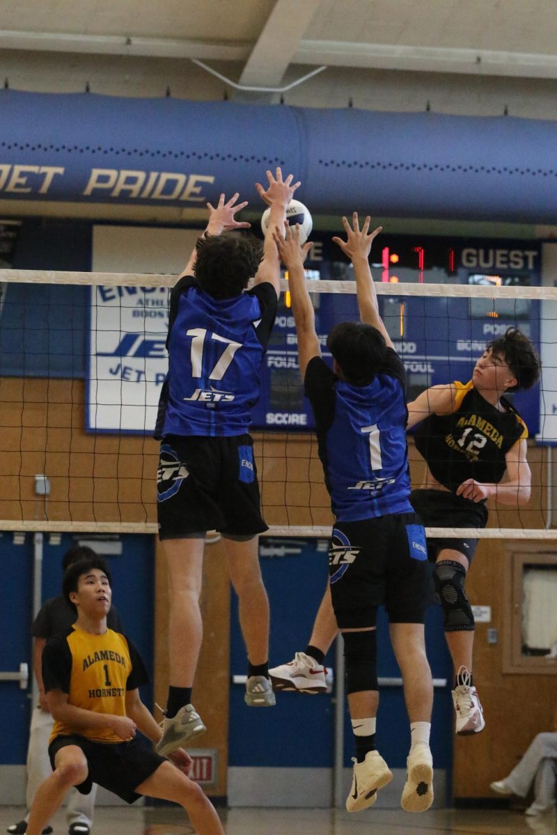 Junior Orion Juhas and senior Jonas Locke jump for the block against Alameda on Mar. 25, 2026. The Jets won 3-0.