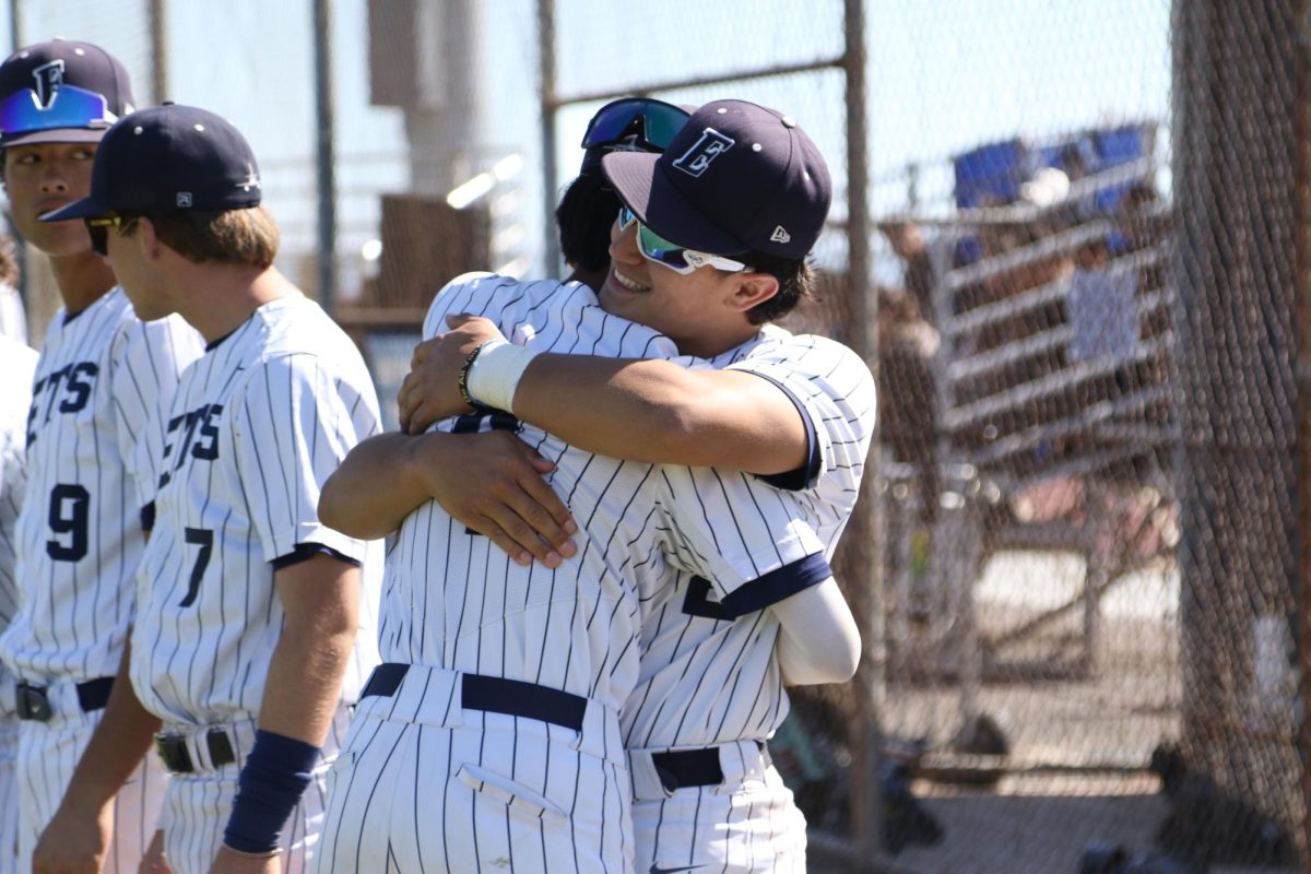 Otenbriet embraces a teammate on Senior Night on May 7, 2026. The Jets beat Piedmont 7-5.