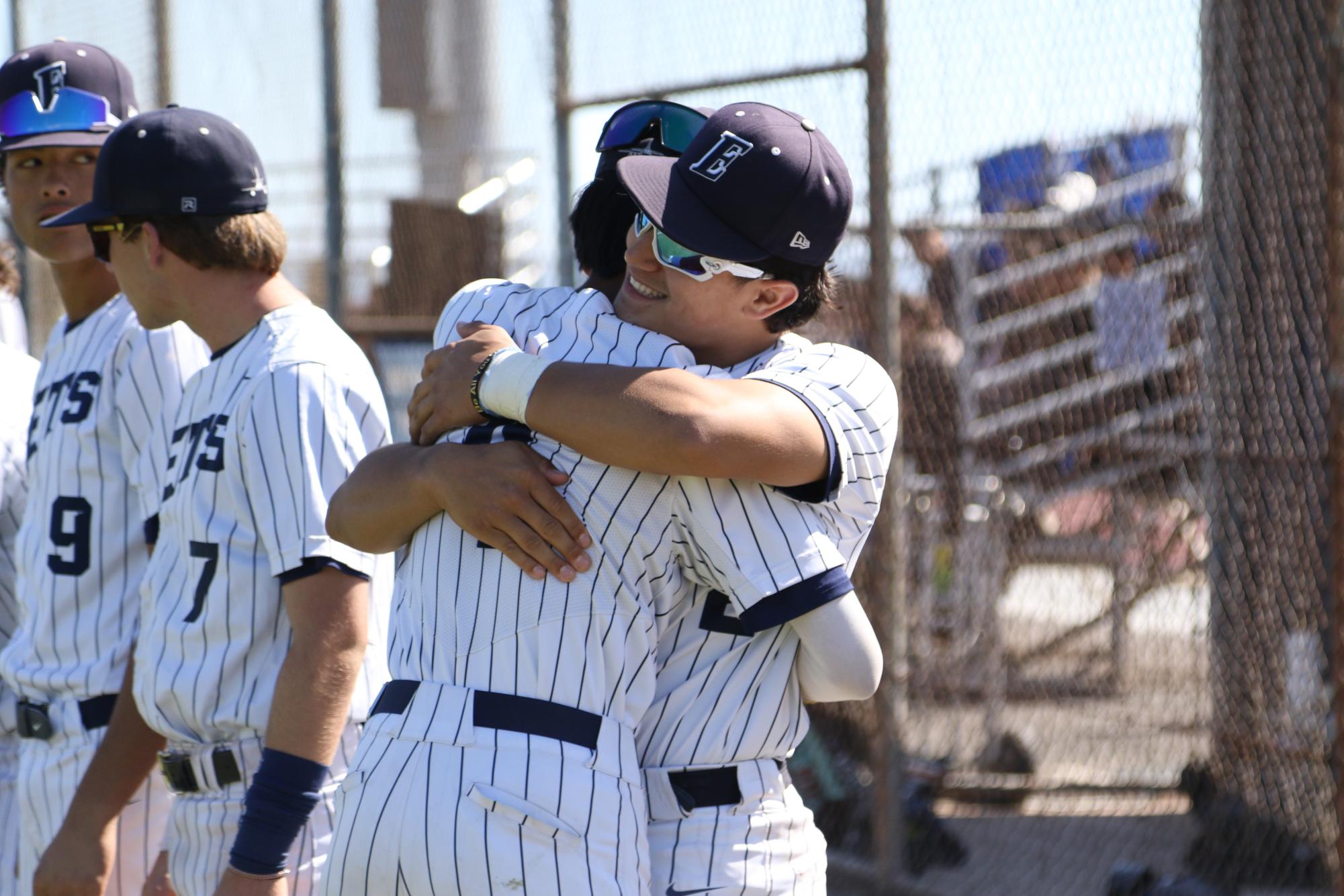 Otenbriet embraces a teammate on Senior Night on May 7, 2026. The Jets beat Piedmont 7-5.